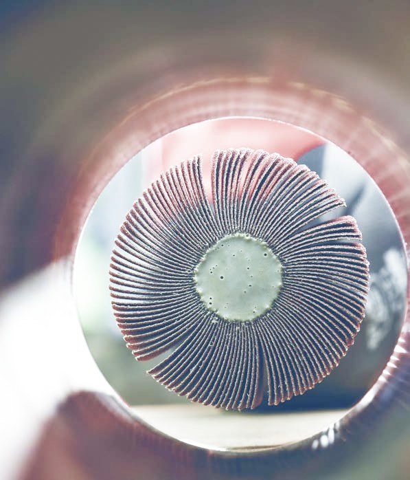 SUHNER abrasive flap wheel finishing the inside of a stainless steel tube