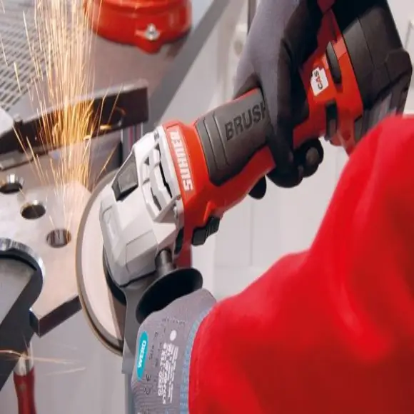 Angle grinder with abrasive disc cutting sheet metal